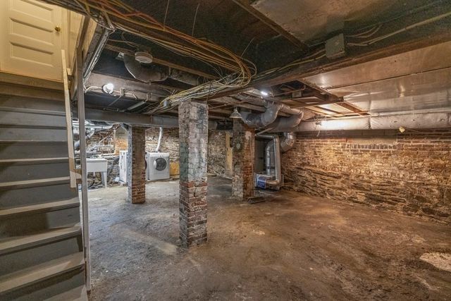 a view of an empty room with wooden roof
