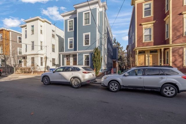 a car parked in front of a buildings