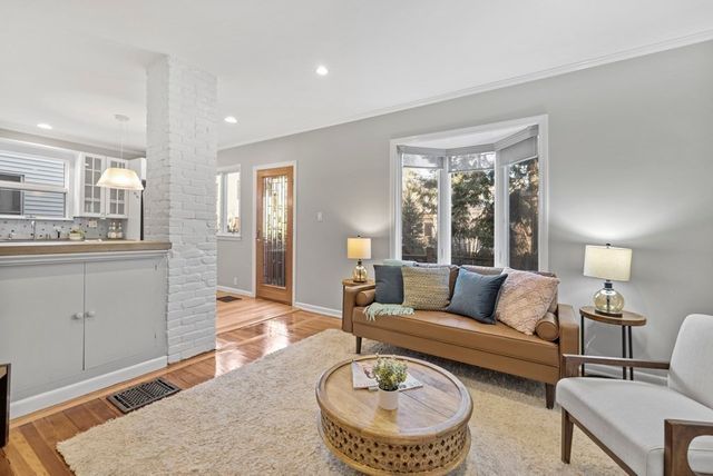 a living room with furniture and a table
