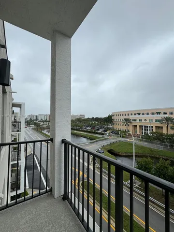 a view of a balcony with an outdoor space