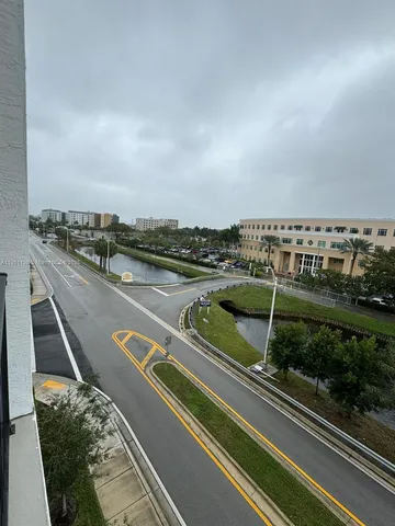 a view of a house with a yard porch and sitting area