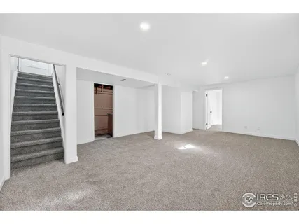 a view of an empty room with a fireplace
