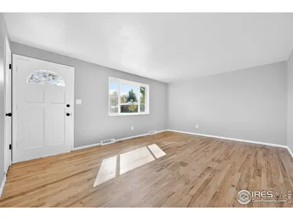 a view of an empty room and window