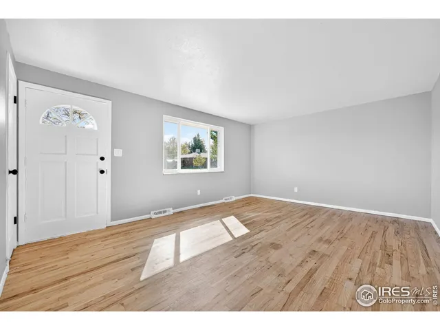 a view of an empty room and window