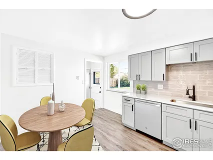 a kitchen with a sink cabinets and window