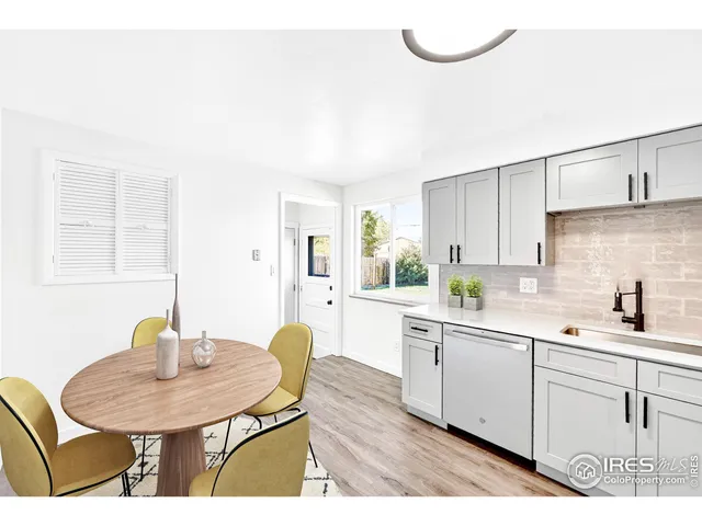 a kitchen with a sink cabinets and window