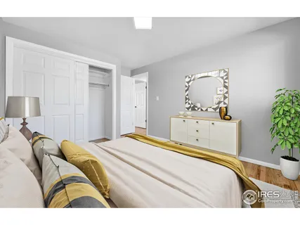 a bedroom with a bed and a dresser