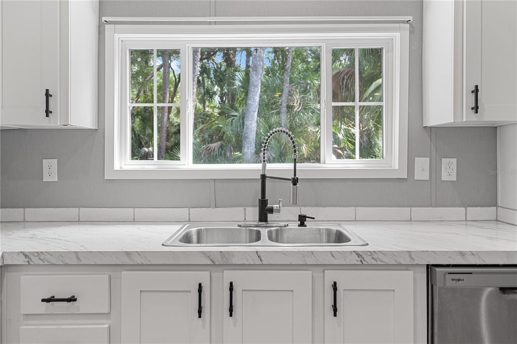 375 Sapp Street Inglis, FL 34449 - Photo 8 of 36 a kitchen with a sink and a window