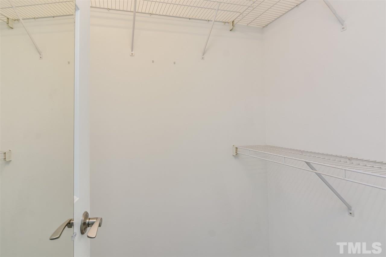 3628 Epperly Court Raleigh, NC 27616 - Photo 13 of 18 a view of small space with racks on the wall