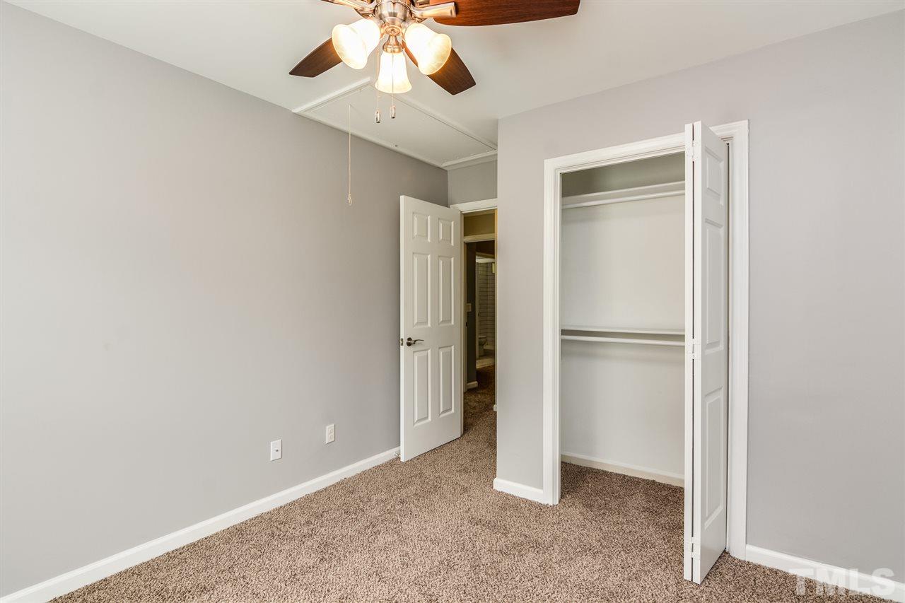 3628 Epperly Court Raleigh, NC 27616 - Photo 15 of 18 a view of an empty room with a ceiling fan