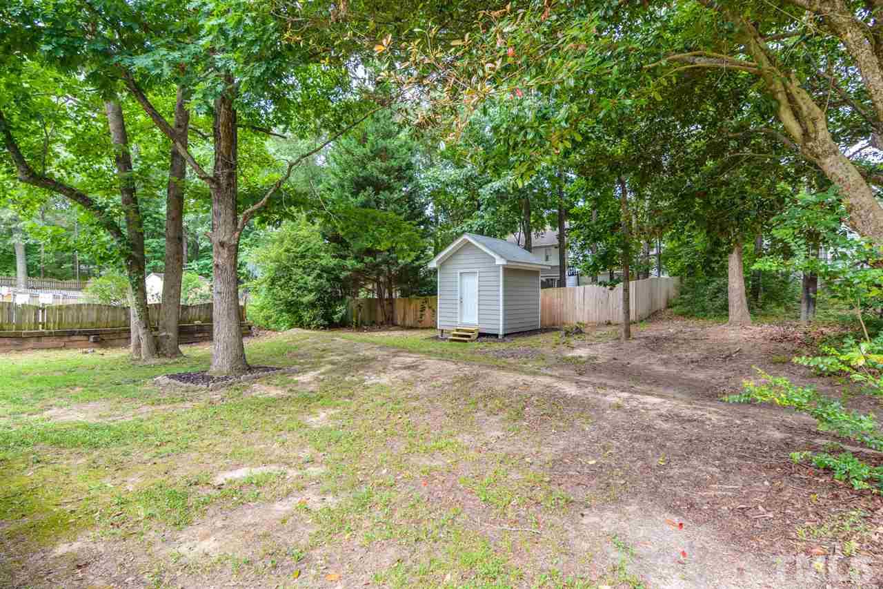 3628 Epperly Court Raleigh, NC 27616 - Photo 17 of 18 a house with trees in front of it