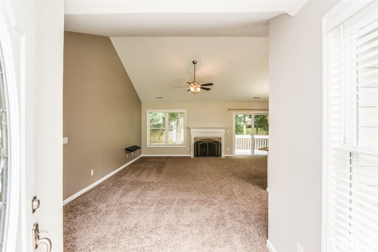 3628 Epperly Court Raleigh, NC 27616 - Photo 7 of 18 a view of an empty room with a fireplace