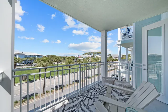 a view of a balcony with lake view and wooden floor