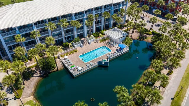 an aerial view of multiple houses with yard