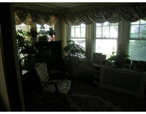 12 Benjamin Road Arlington, MA 02476 - Photo 11 of 11 a living room with furniture and a potted plant