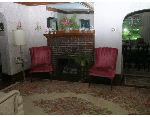 12 Benjamin Road Arlington, MA 02476 - Photo 8 of 11 a room with furniture mirror and a fireplace
