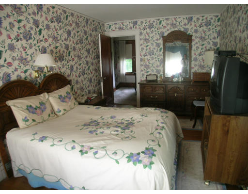 12 Benjamin Road Arlington, MA 02476 - Photo 10 of 11 a bedroom with a bed and a mirror
