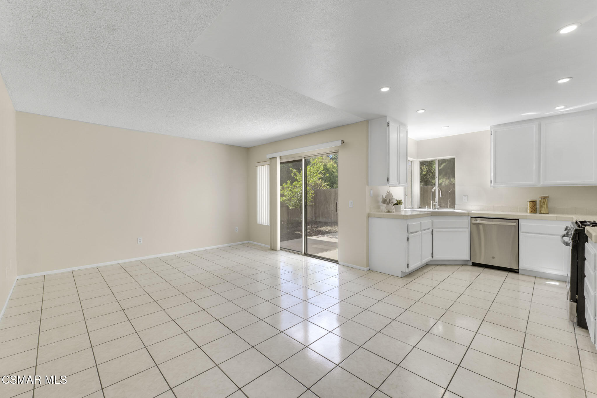 6635 Pecan Avenue Moorpark, CA 93021 - Photo 11 of 54 a view of a kitchen with white cabinets and sink