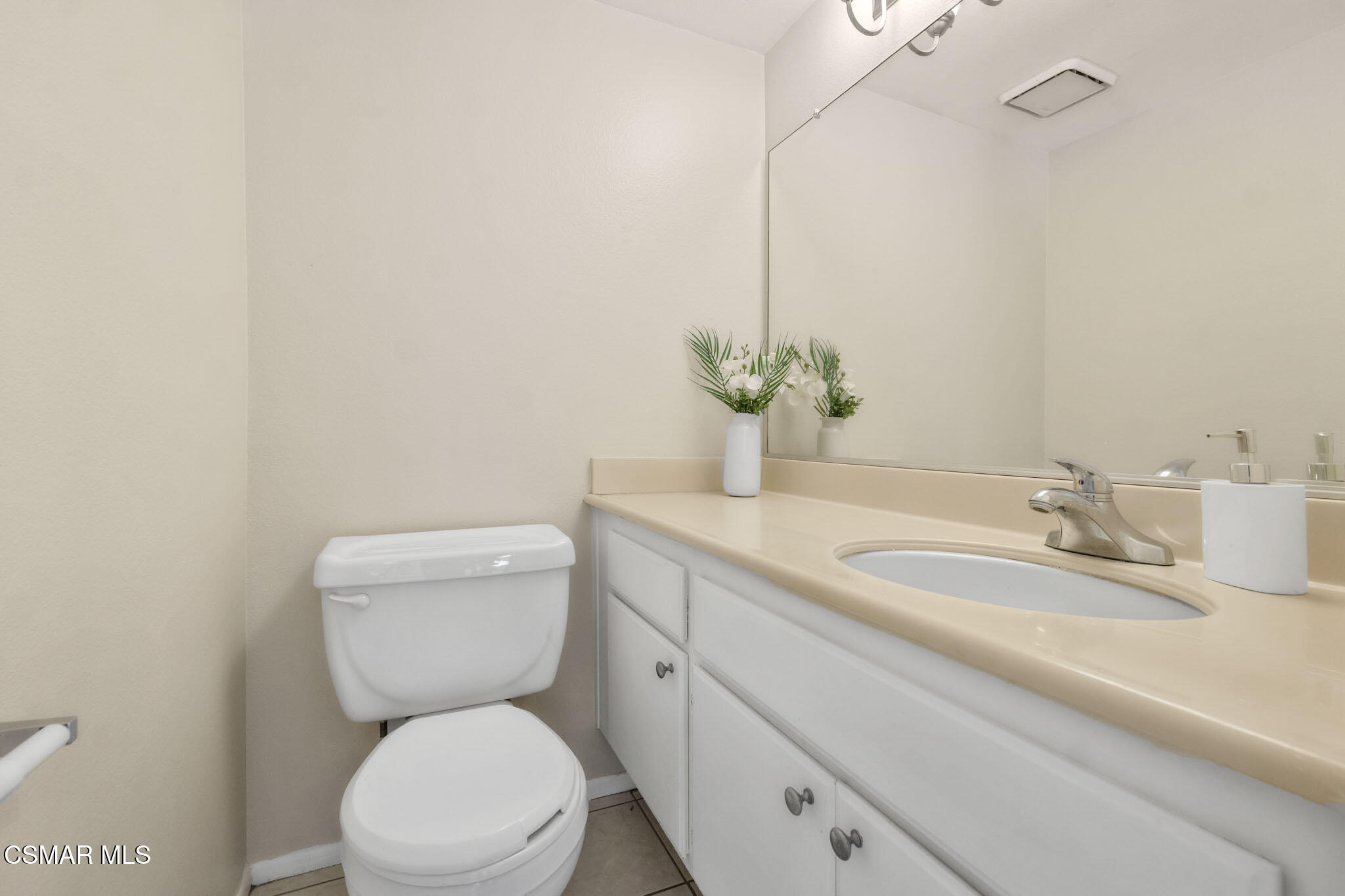 6635 Pecan Avenue Moorpark, CA 93021 - Photo 20 of 54 a bathroom with a granite countertop toilet sink and mirror