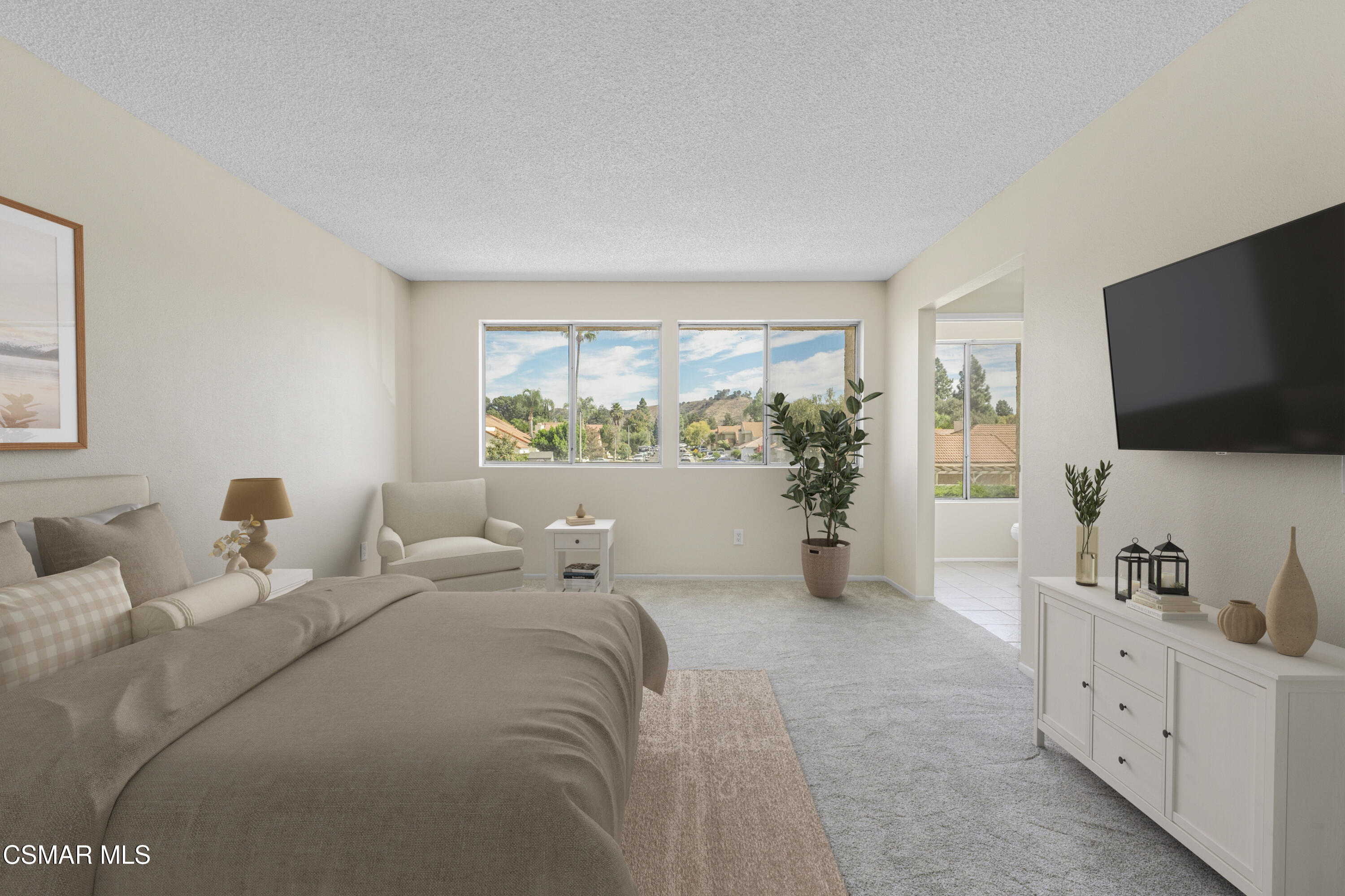 6635 Pecan Avenue Moorpark, CA 93021 - Photo 22 of 54 a large bedroom with a bed and flat tv screen on the dresser