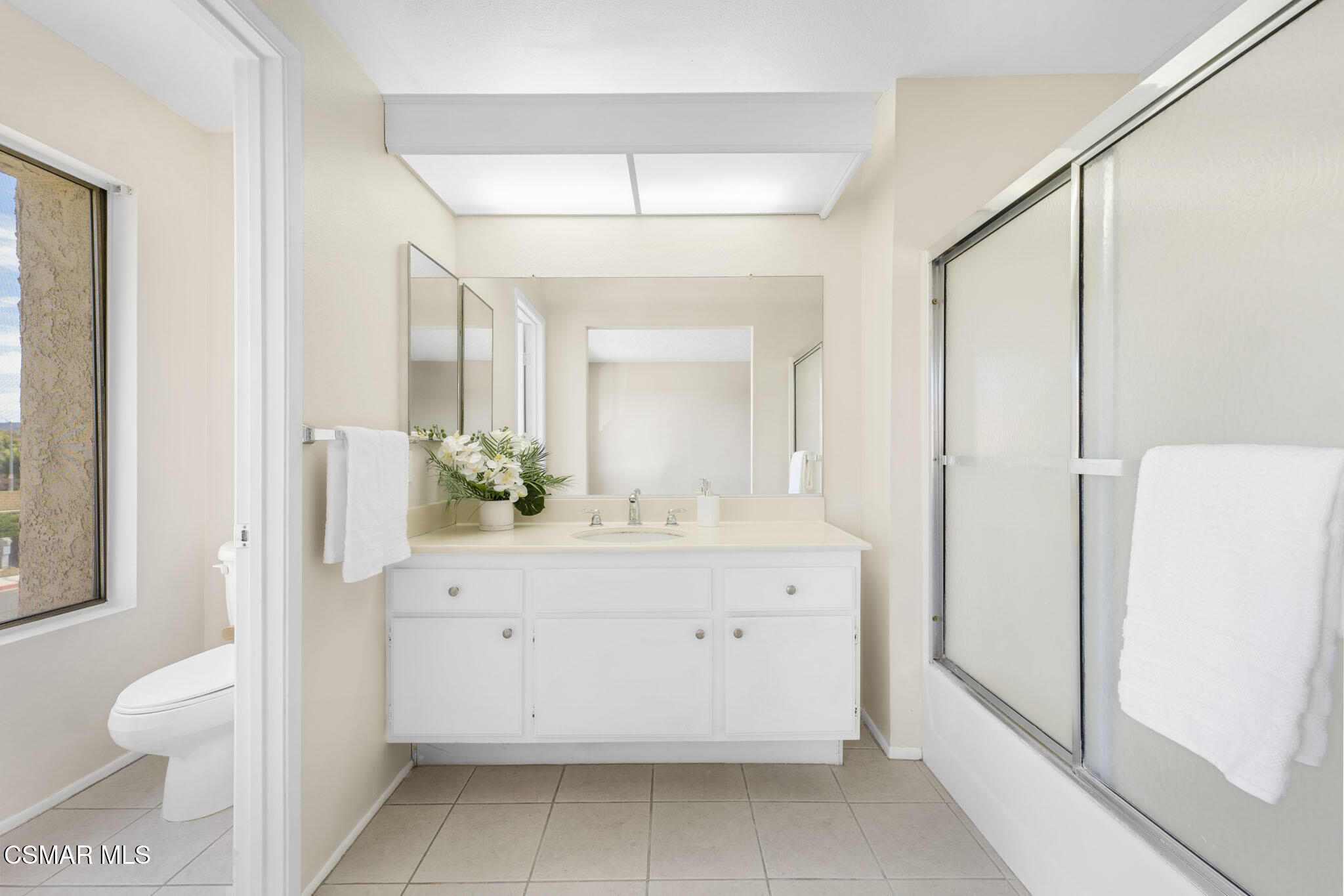 6635 Pecan Avenue Moorpark, CA 93021 - Photo 28 of 54 a bathroom with a sink a toilet and a mirror