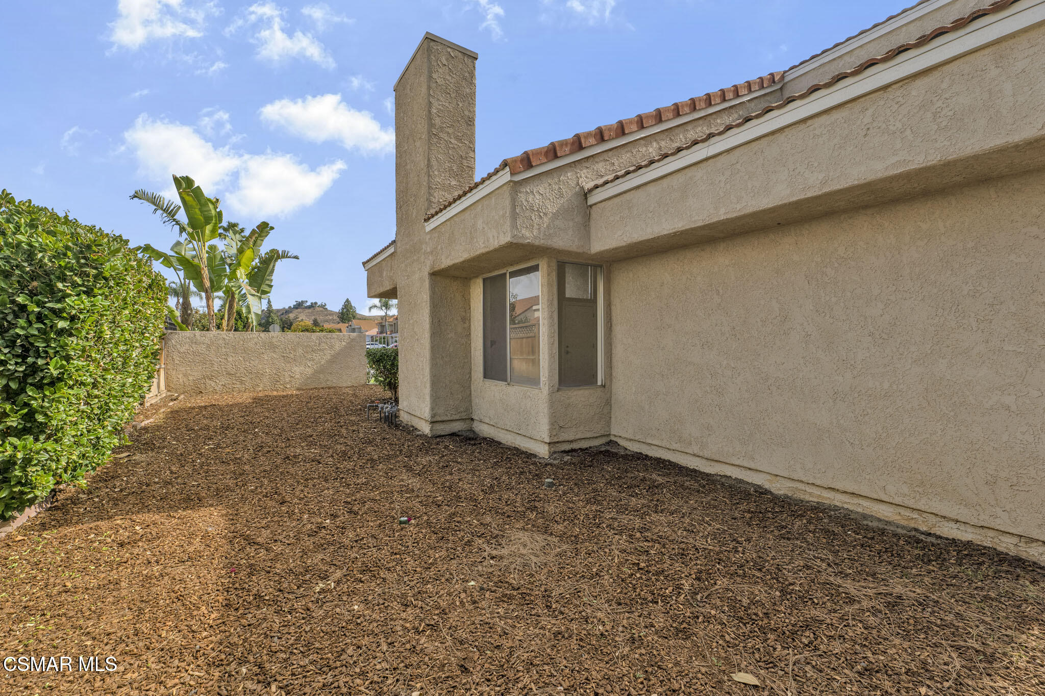 6635 Pecan Avenue Moorpark, CA 93021 - Photo 42 of 54 a view of a front of house with potted plants