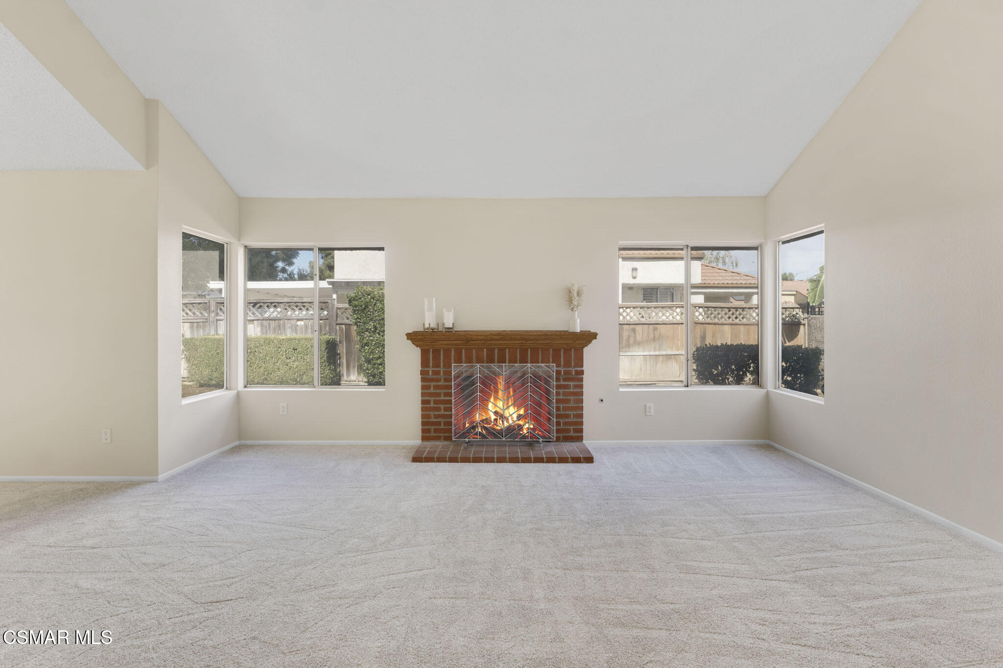 6635 Pecan Avenue Moorpark, CA 93021 - Photo 6 of 54 an empty room with windows and fireplace