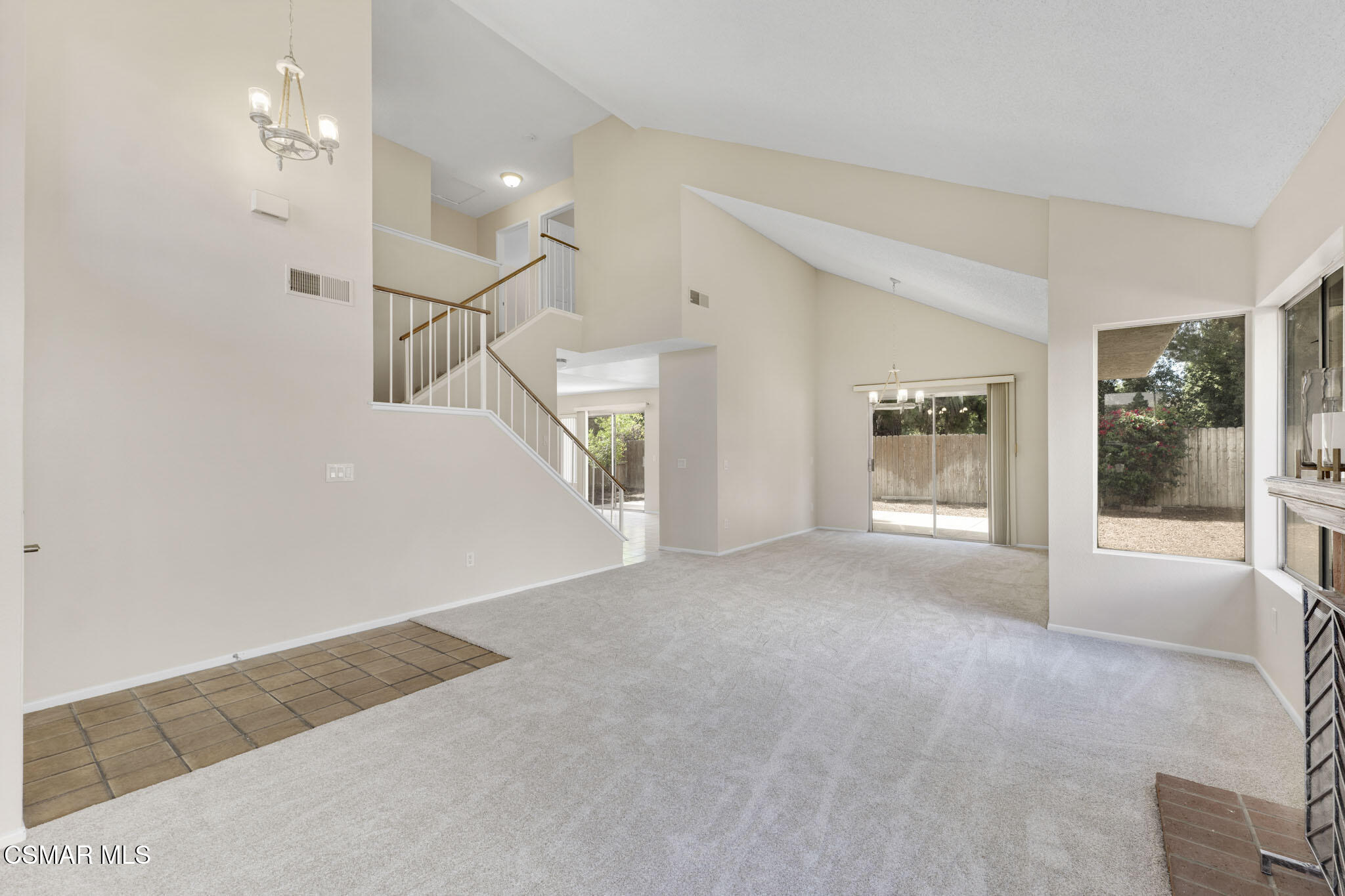 6635 Pecan Avenue Moorpark, CA 93021 - Photo 7 of 54 a view of a big room with windows and chandelier fan