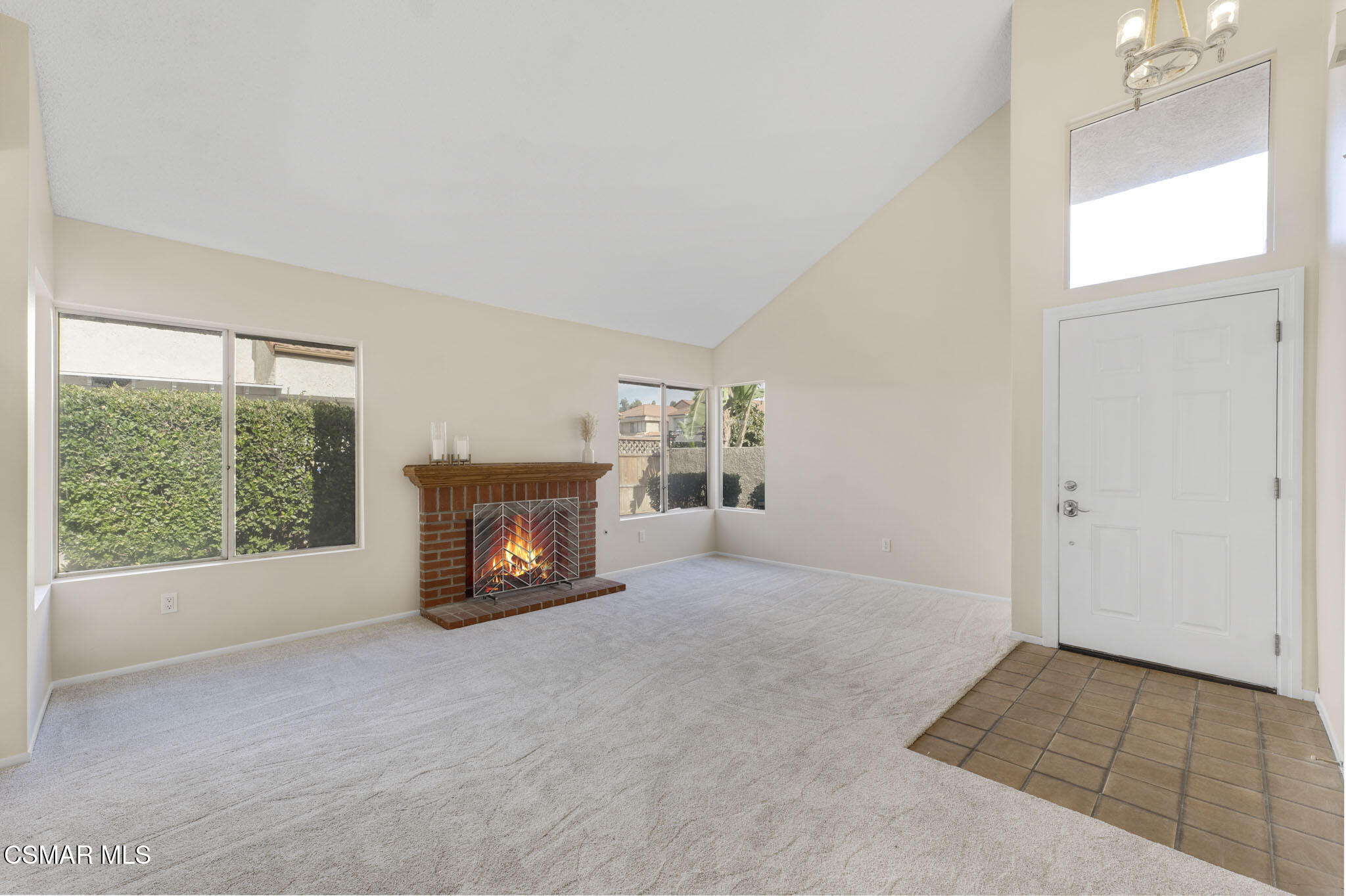 6635 Pecan Avenue Moorpark, CA 93021 - Photo 10 of 54 an empty room with a fireplace and window