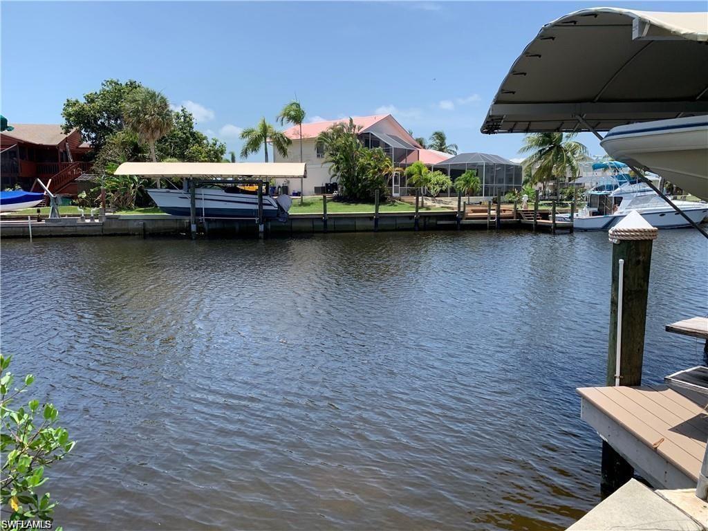 3200 Stabile Road St. James City, FL 33956 - Photo 2 of 7 a view of a lake with chairs
