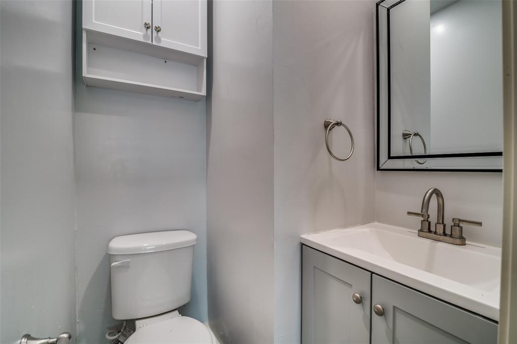 3605 Delia Street Rowlett, TX 75088 - Photo 9 of 12 Half bathroom featuring vanity and toilet