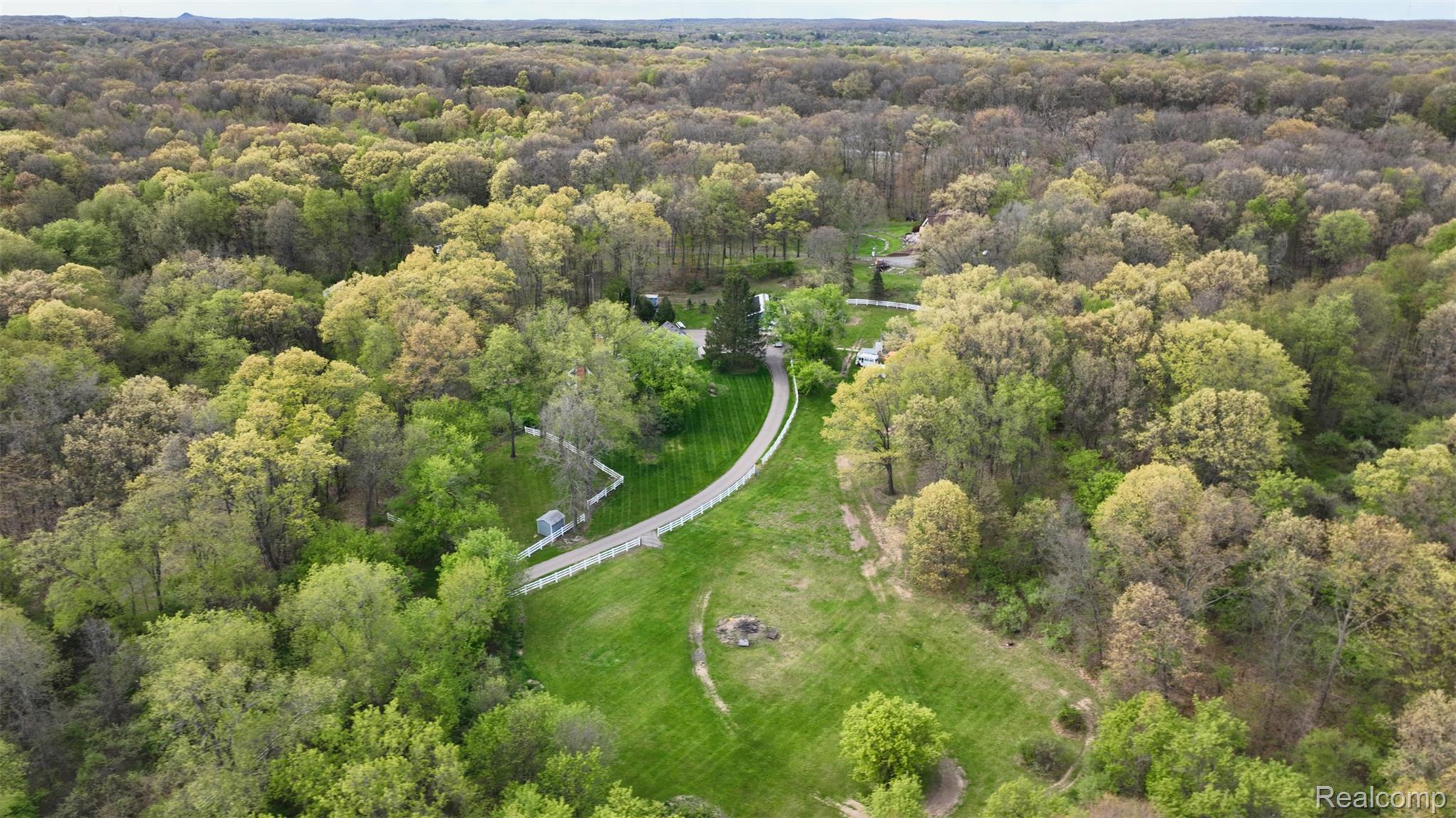 10300 Clark Road Davisburg, MI 48350 - Photo 34 of 39 Bird's eye view of a heavily wooded area