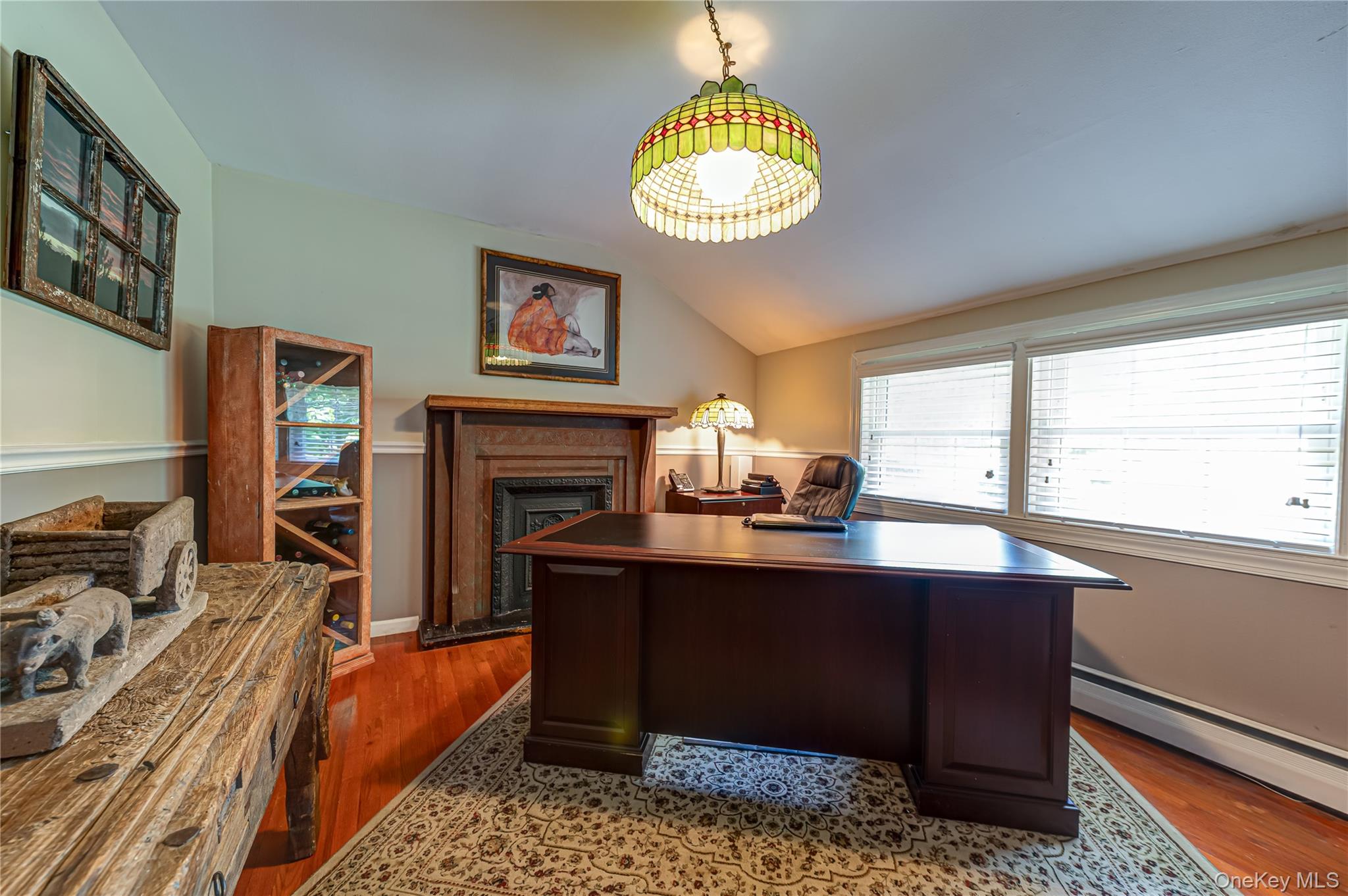 3 Thompson Hill Road St. James, NY 11780 - Photo 10 of 34 a dining room with furniture a chandelier and a fireplace