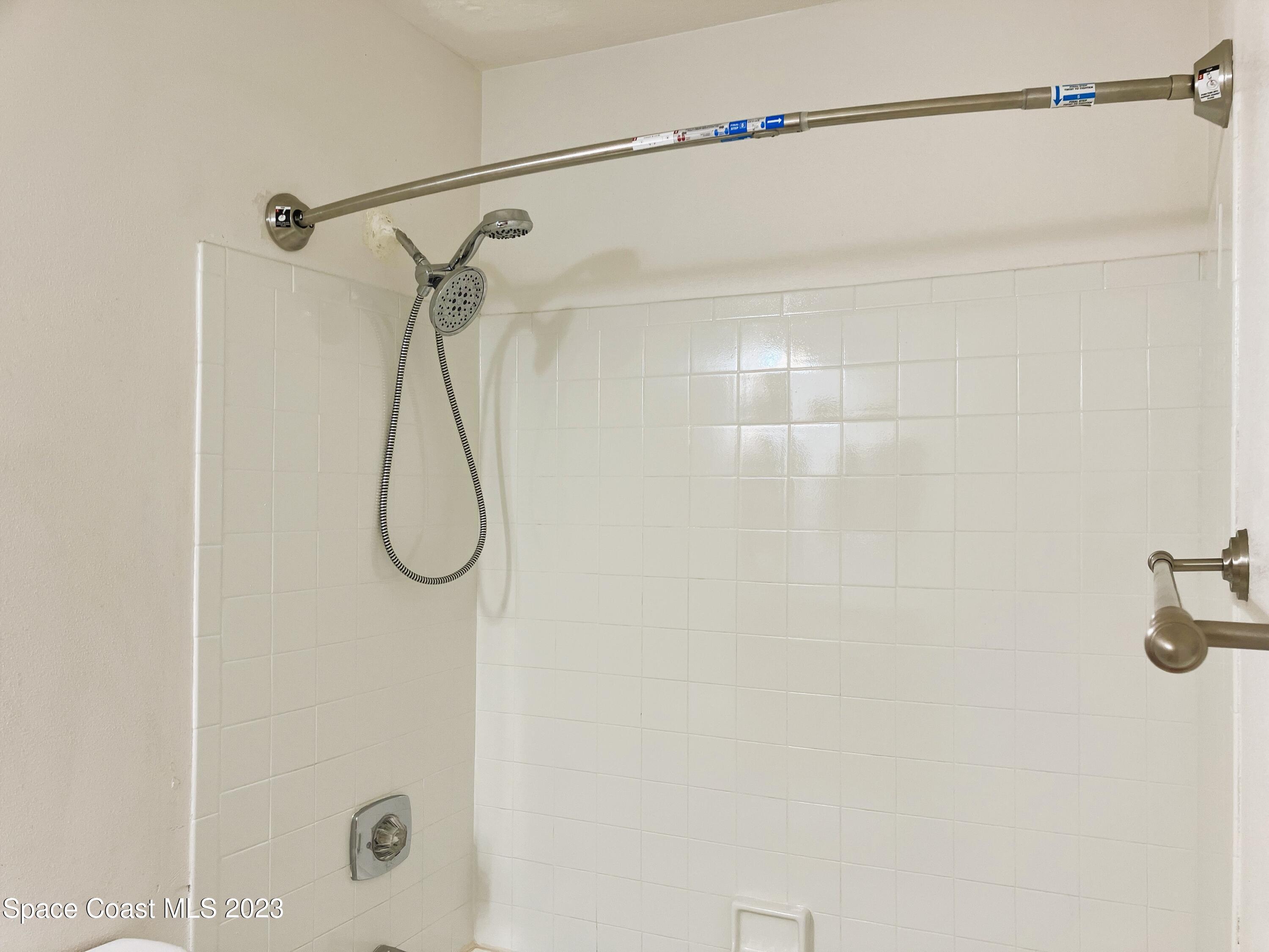7667 North Wickham Road, Unit 304 Melbourne, FL 32940 - Photo 32 of 36 a bathroom with a shower