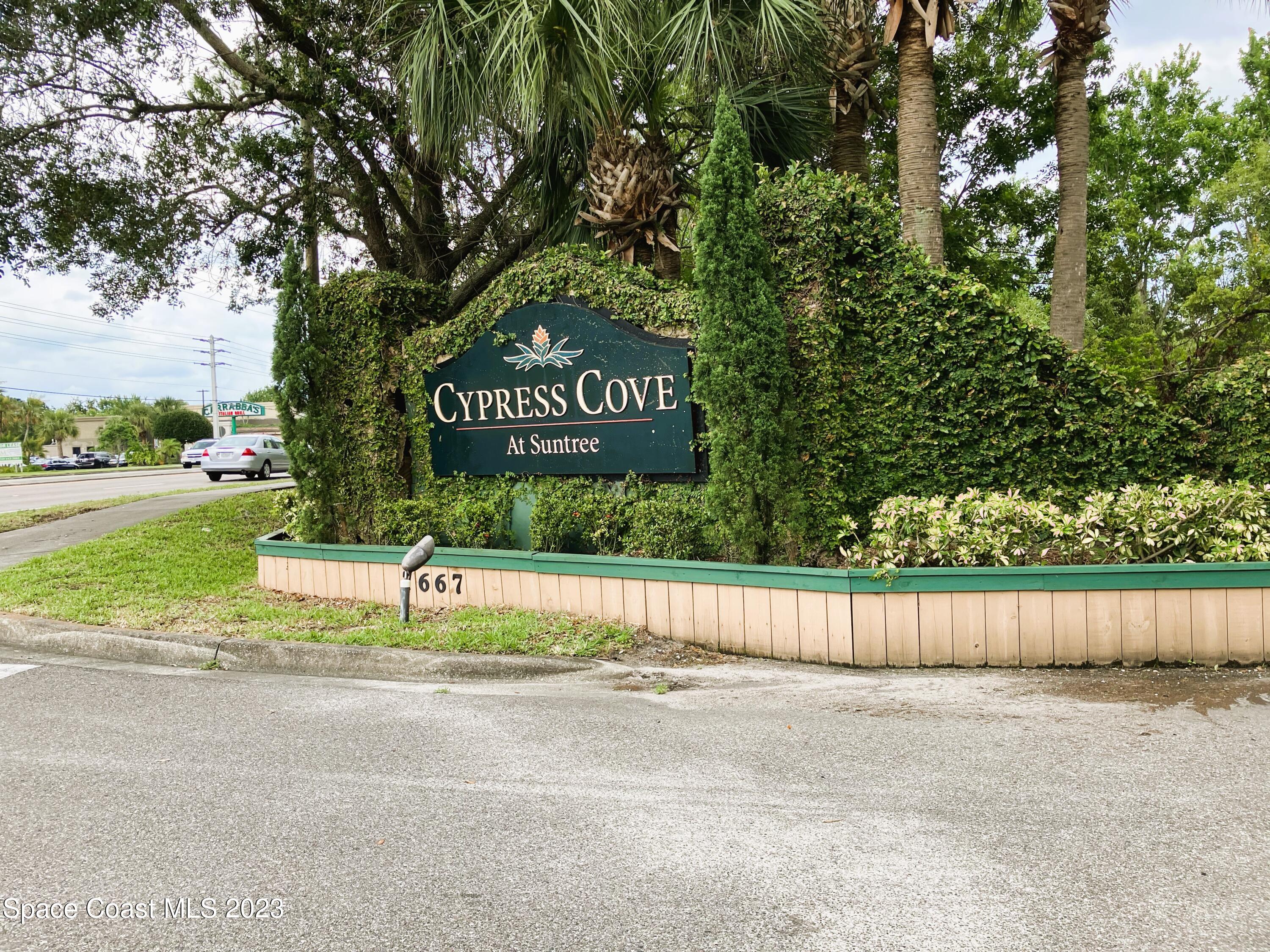 7667 North Wickham Road, Unit 304 Melbourne, FL 32940 - Photo 36 of 36 a view of a street with a sign board
