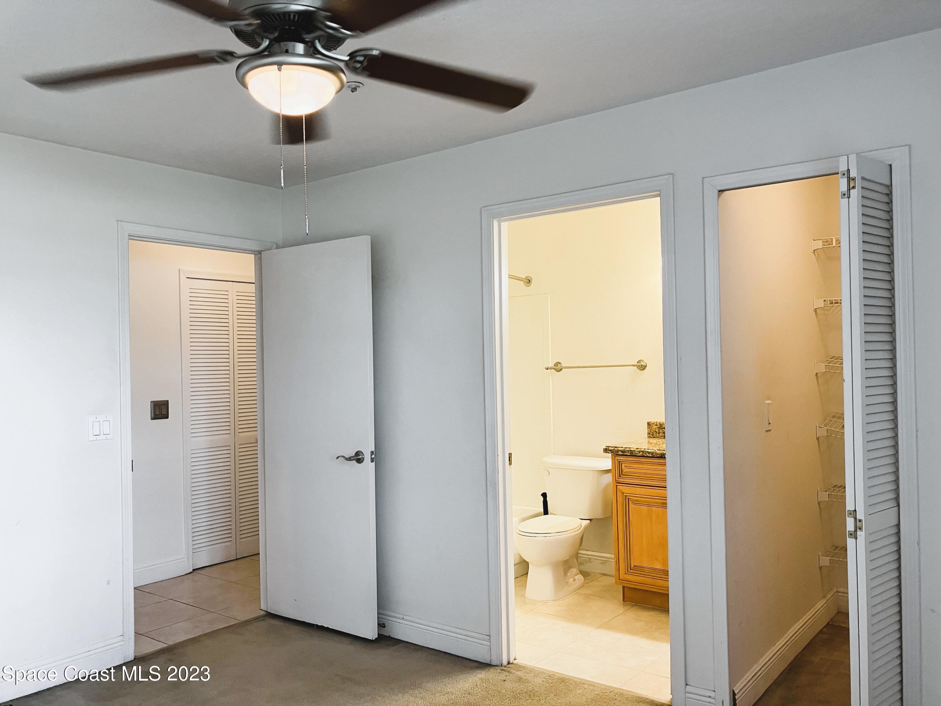 7667 North Wickham Road, Unit 304 Melbourne, FL 32940 - Photo 10 of 36 a view of bathroom with a tub shower and a view