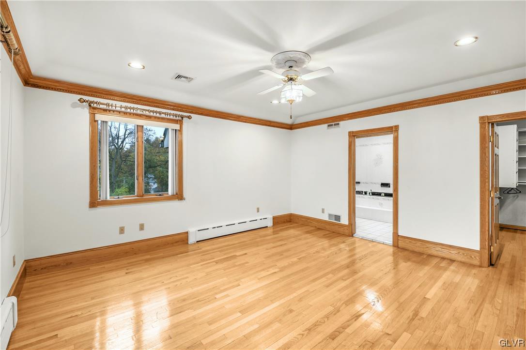 3166 Apollo Drive Bethlehem, PA 18017 - Photo 19 of 37 a view of an empty room with window and wooden floor