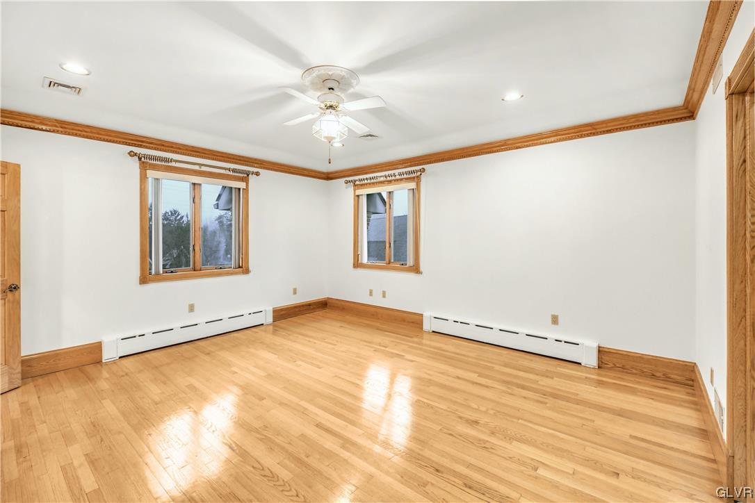 3166 Apollo Drive Bethlehem, PA 18017 - Photo 20 of 37 a view of an empty room with window and wooden floor
