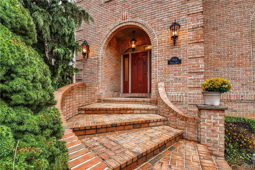3166 Apollo Drive Bethlehem, PA 18017 - Photo 3 of 37 a front view of a house with a garden