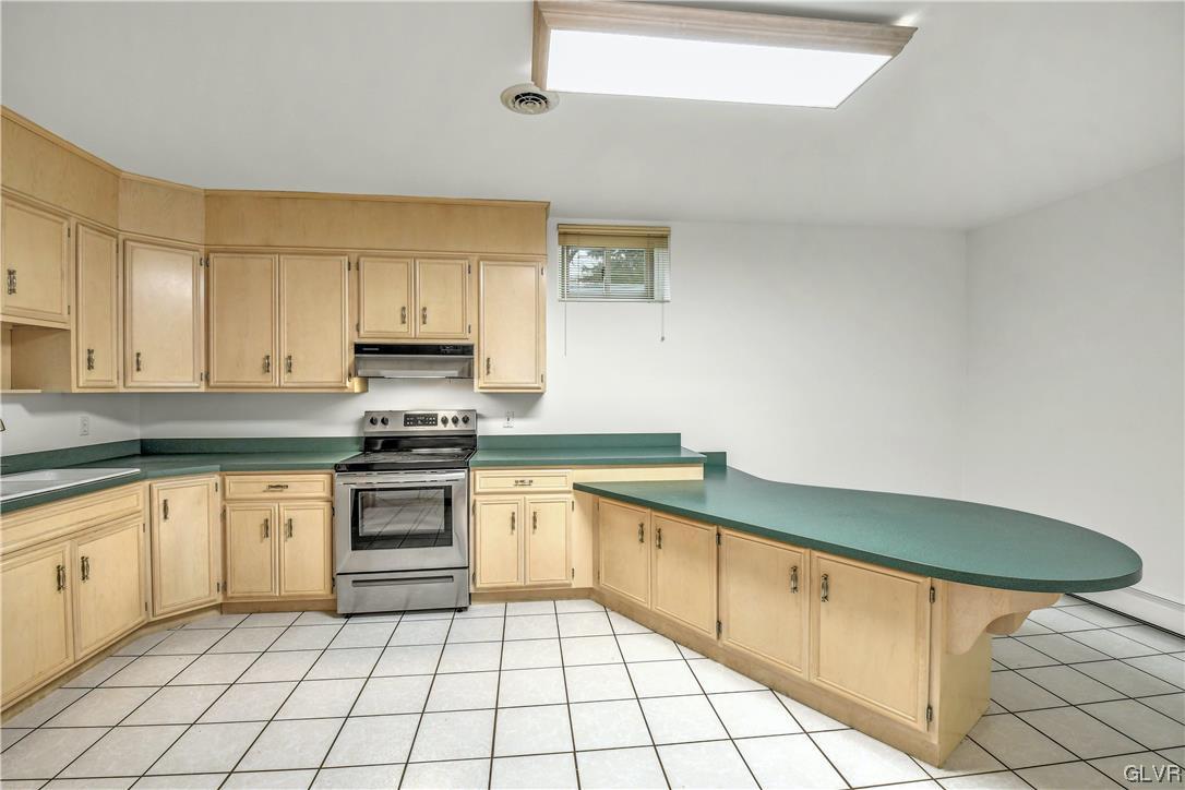 3166 Apollo Drive Bethlehem, PA 18017 - Photo 32 of 37 a kitchen with stainless steel appliances granite countertop a sink and cabinets