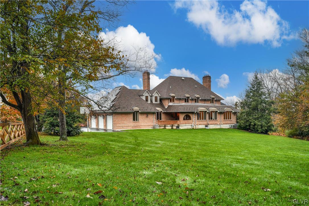 3166 Apollo Drive Bethlehem, PA 18017 - Photo 36 of 37 a view of a white house with a big yard and large trees