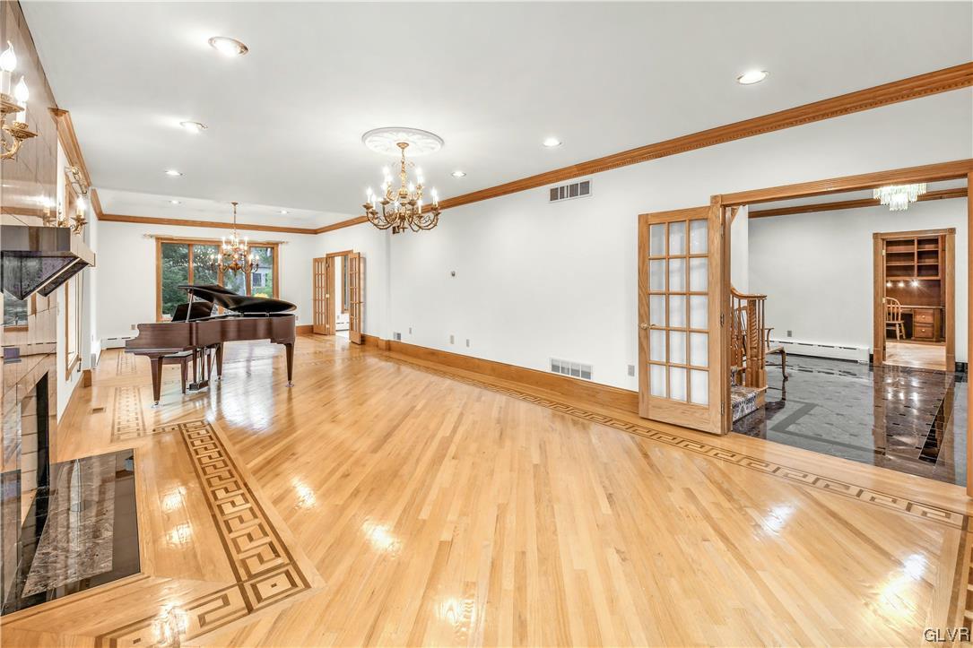 3166 Apollo Drive Bethlehem, PA 18017 - Photo 7 of 37 a view of a living room and kitchen with granite countertop wooden floor