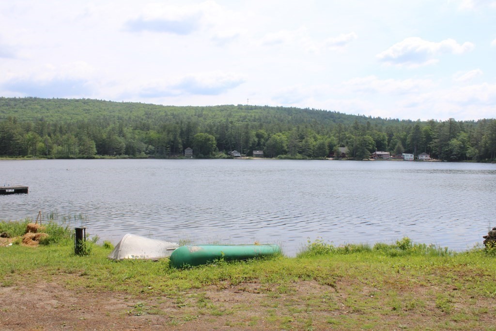 319 Wendell Road Warwick, MA 01378 - Photo 4 of 16 a view of a lake with mountain in the back