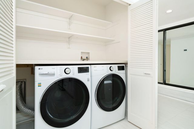 a bathroom with a double vanity sink and mirror