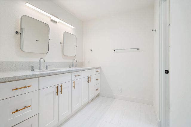 an empty room with sliding door and windows