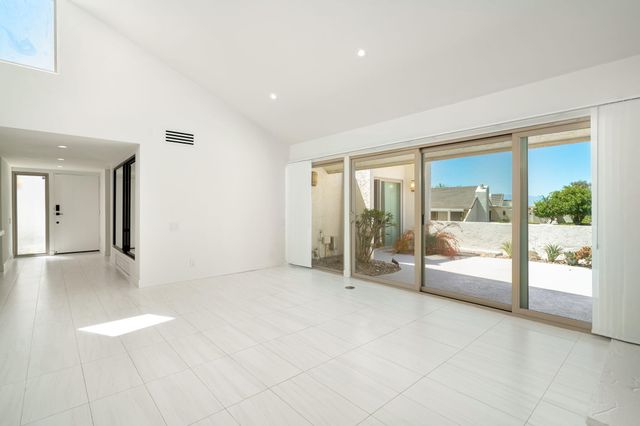 a view of a living room a fireplace and entryway
