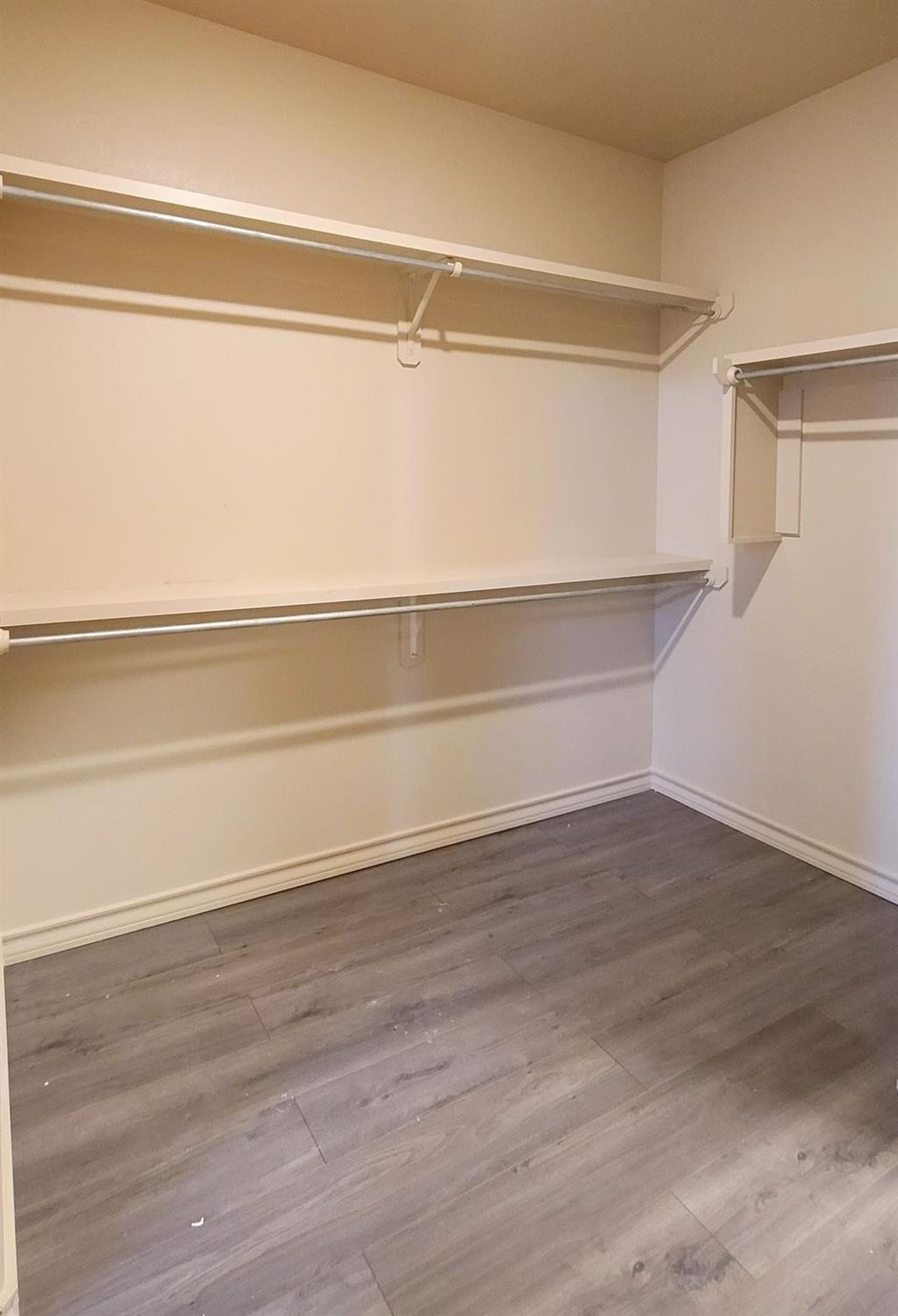 5234 Kemper Street Lubbock, TX 79416 - Photo 17 of 28 a view of an empty walk in closet