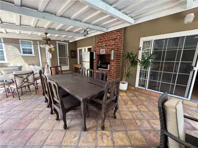 a view of a dining room with furniture and window
