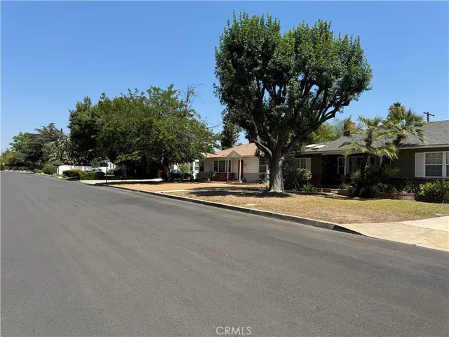 a view of house with outdoor space and street view