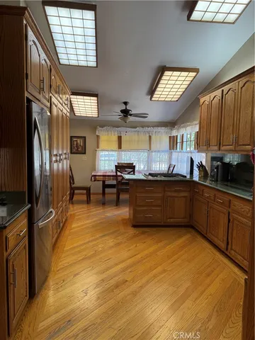 a kitchen with stainless steel appliances a sink a stove and a refrigerator